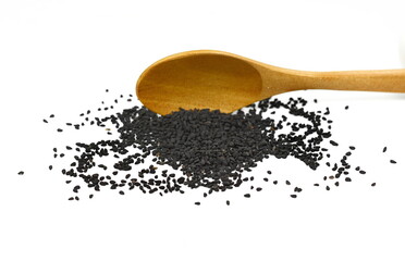 Wall Mural - Heap of black nigella seeds in a wooden spoon. Pile of black cumin seeds spice isolated on white background.