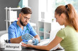 © Pixel-Shot - Young woman undergoing allergen skin test in clinic