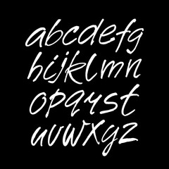 Wall Mural - vector acrylic brush style hand drawn alphabet font. calligraphy alphabet on a black background