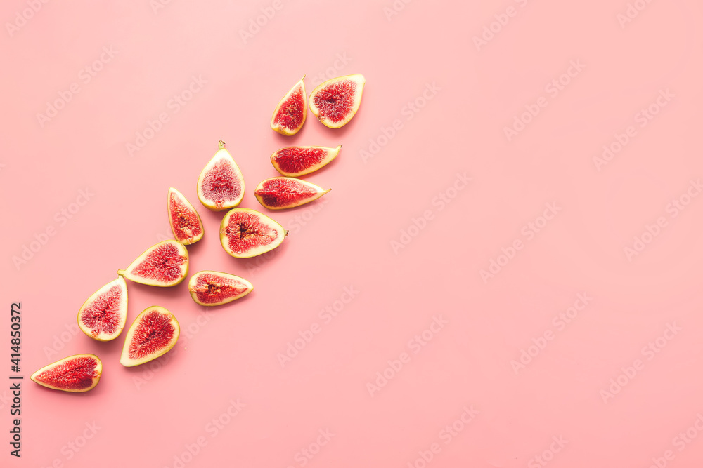 Cut fresh green figs on color background