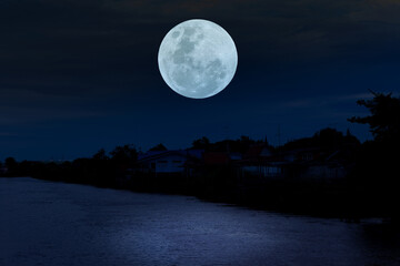 Wall Mural - full moon on sky over river at night.