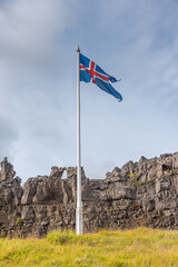 Flagpole with flag of Iceland at former Althingi site at Thingvellir national park