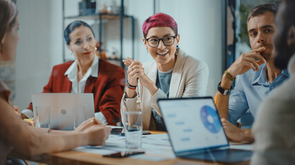 Aufkleber - Office Meeting in Conference Room: Beautiful Specialist with Short Pink Hair Talks about Firm Strategy with Diverse Team of Professional Businesspeople. Creative Start-up Team Discusses Big Project 