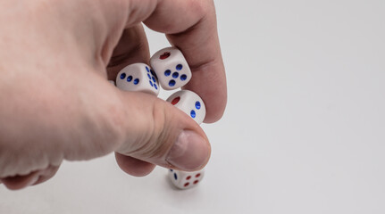 White game cubics in hand. Concept of luck, chance and leisure fun.