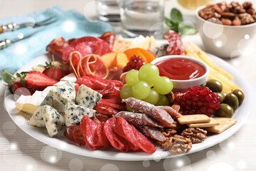 Wall Mural - Plate of different appetizers with dip sauce on white table, closeup. Bokeh effect