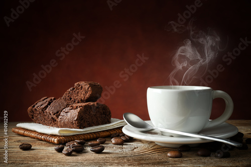 Obraz Dibond Espresso cup, biscuits and coffee beans on wooden background, space for text.