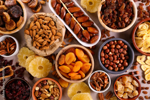 assorted nuts and dried fruit background-organic food © M.studio