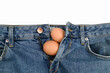 chicken eggs in jeans, on an isolated white background