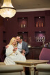 © Svitlana - Happy couple sharing a nice evening at fancy lounge