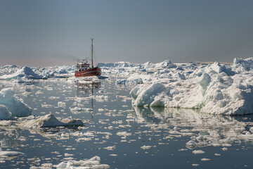 Sticker - Beautiful view of tourist boat sailing through icebergs in Disko Bay, Greenland