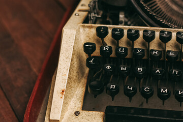 Fototapete - typewriter with keys letters paper wood background texture