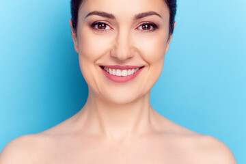 Wall Mural - Cropped photo of young woman happy positive smile face correction lifting hydration cosmetology isolated over blue color background