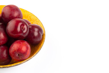 Wall Mural - Red round plum on white background