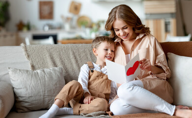 Wall Mural - Mother and son reading greeting card