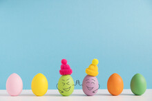 Friends High Five To Each Other. Positive Eggs In Hats. Easter Holiday Concept With Cute Eggs With Funny Faces. Different Emotions And Feelings.