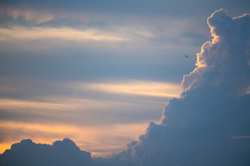 Wall Mural - Clouds in the evening sky and planes