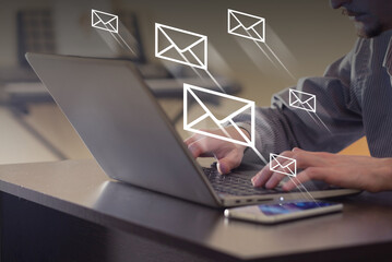 mail flying away from laptop. person sending mail in office. communication, remote working and insta