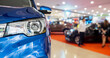new cars in dealer showroom interior background