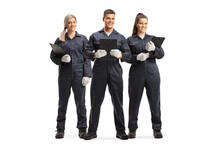 Full Length Portrait Of A Team Od Female And Male Mechanics In Uniforms
