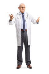 Canvas Print - Full length portrait of a mature doctor gesturing with hands