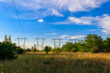 High voltage power line against blue sky