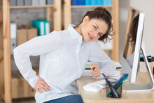 Young Stressed Businesswoman Having Back Pain