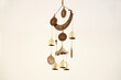 Isolated shot of hanging decorative wind chime with bells on white background