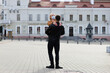 © Ivan Zelenin - Young couple hugging wearing a face protection mask in the city center.