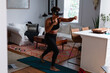 © Gerald R Carter Jr/Creative Flame - Black woman does boxing exercise at home using virtual reality technology