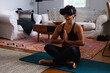 © Gerald R Carter Jr/Creative Flame - Woman African-American doing virtual reality breathing, relaxation, and meditation exercise