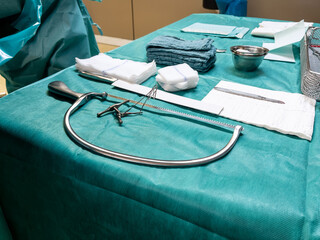 on an operating table are the instruments for performing a leg amputation