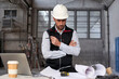 © Veam/Westend61 - Male engineer thinking while analyzing blueprint on table in building