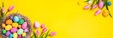 Easter - Decorated Eggs In Nest With Pink Tulips In Yellow Background