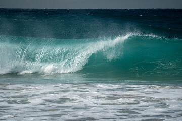 A beautiful perfect wave breaking on the coast