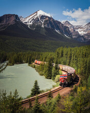 The Canadian Pacific Railway Thunders Around Morants Curve In Banff National Park During The Summer.