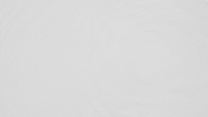 Poster - Close up top view of water droplets falling into the water and separate splashes of water on gray background in 4k slow motion.
