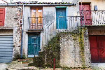 Sticker - Italy, Sicily, Palermo Province, Geraci Siculo. Apartment building with colorful doors in the town of Geraci Siculo.