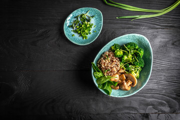 Canvas Print - Diet salad made from fresh vegetables broccoli, mushrooms, spinach and quinoa in a bowl. Delicious breakfast or snack, Clean eating, dieting, vegan food concept. vertical image