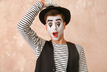 Male Pantomimist On Color Background