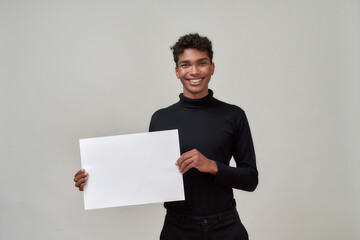 Happy young african american man holding blank bill