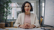 © Gorodenkoff - Point of View from Camera Portrait of Beautiful Multiethnic Latina Project Manager Having Video Call in Creative Office Environment. Happy Female Specialist Listening to a Colleague Over Live Camera.