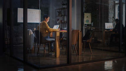 Poster - Young Latin Marketing Specialist with Short Hair in Glasses Working on Laptop Computer in Busy Creative Office Environment. Beautiful Diverse Multiethnic Female Project Manager Making a Presentation.