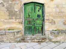 Old Green Door Entrance In The Old Town Of Matera.