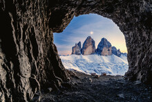Tre Cime Di Lavaredo Lit By Moon Seen From Opening In Rocks Of A War Cave, Sesto Dolomites, Trentino-Alto Adige