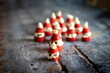 © robertharding - Close-up of cute strawberries shaped as Santa Claus filled with whipped cream and chocolate pieces for Christmas