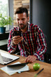 © JustLife - Businessman typing a message. Company manager on his phone sending a message