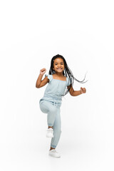 Wall Mural - Happy longhair brunette little girl isolated on white studio background with copyspace for ad. Looks happy, cheerful, sincere. Childhood, education, human emotions, facial expression concept.