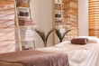 © New Africa - Stylish massage room interior in spa salon