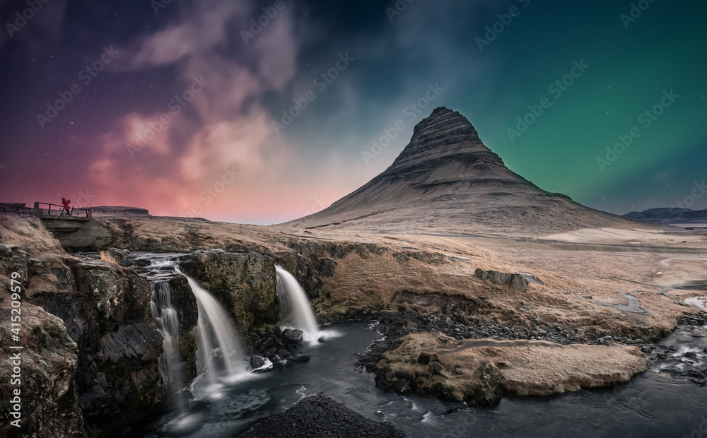 Northern lights aurora borealis over kirkjufell waterfall in Iceland - obrazy, fototapety, plakaty 