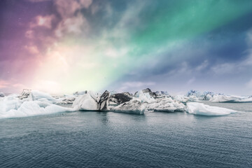 Wall Mural - Northern lights aurora borealis over Jokulsarlon glacier ice lagoon in Iceland